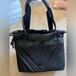 Steve Madden puffer style black tote bag with drawings.